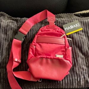Red HADAKI adjustable urban sling bag